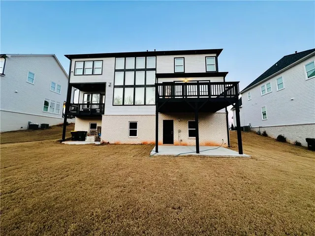 a front view of a house with a street