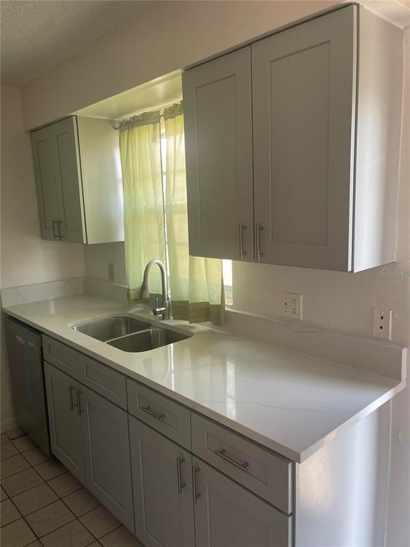 6410 Moss Way Tampa, FL 33625 - Photo 2 of 11 a kitchen with a sink and cabinets