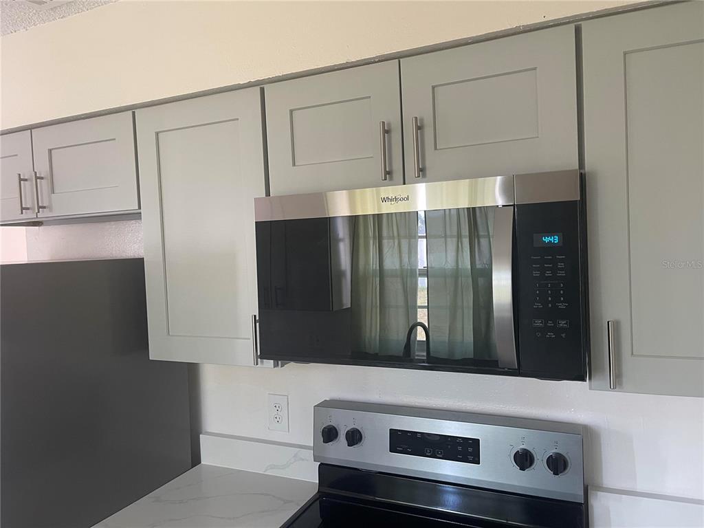 6410 Moss Way Tampa, FL 33625 - Photo 5 of 11 a bathroom with a double vanity sink and mirror