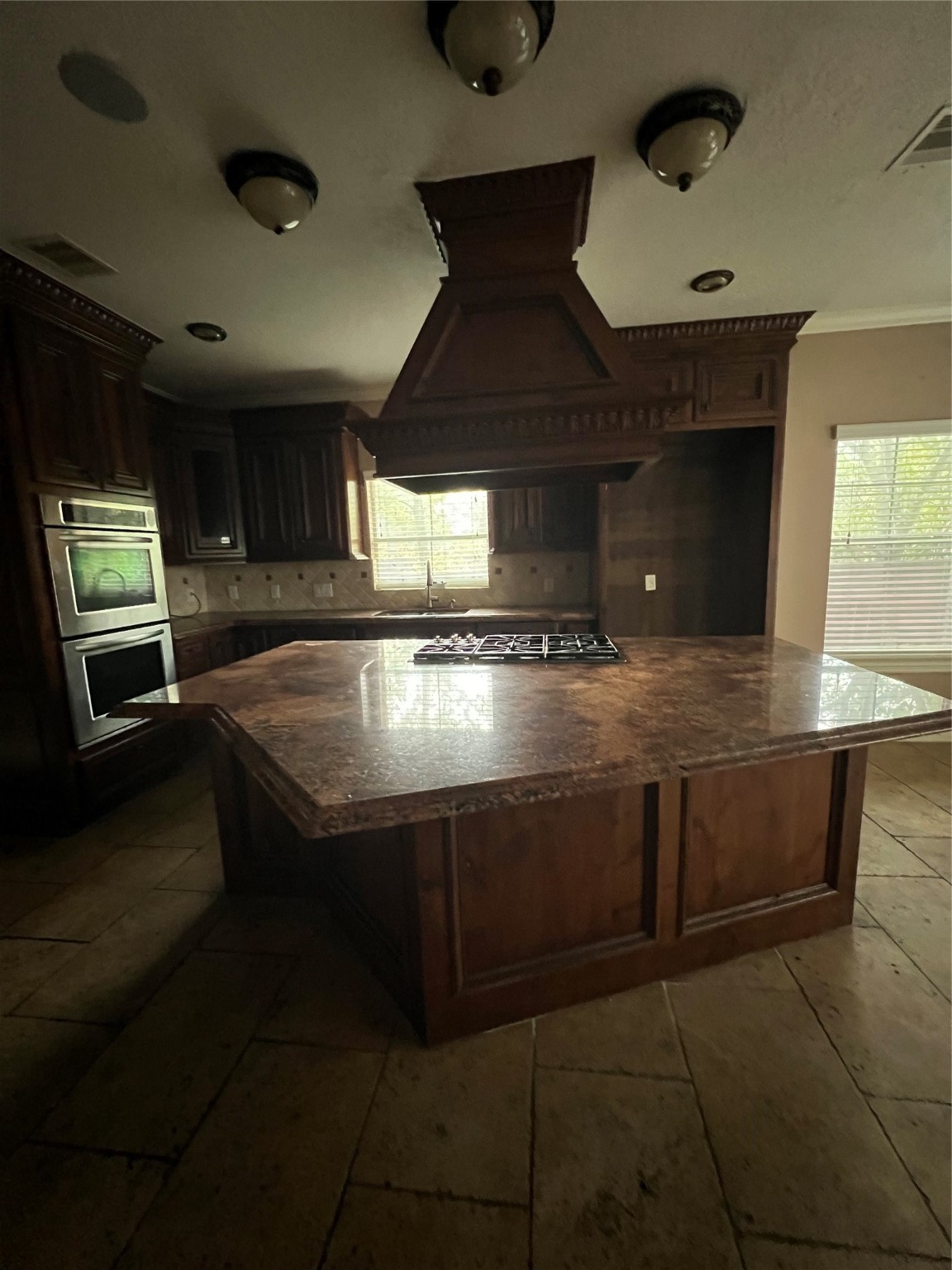 5771 Belarbor Street Houston, TX 77033 - Photo 4 of 6 a view of a kitchen with stainless steel appliances granite countertop a sink and a stove