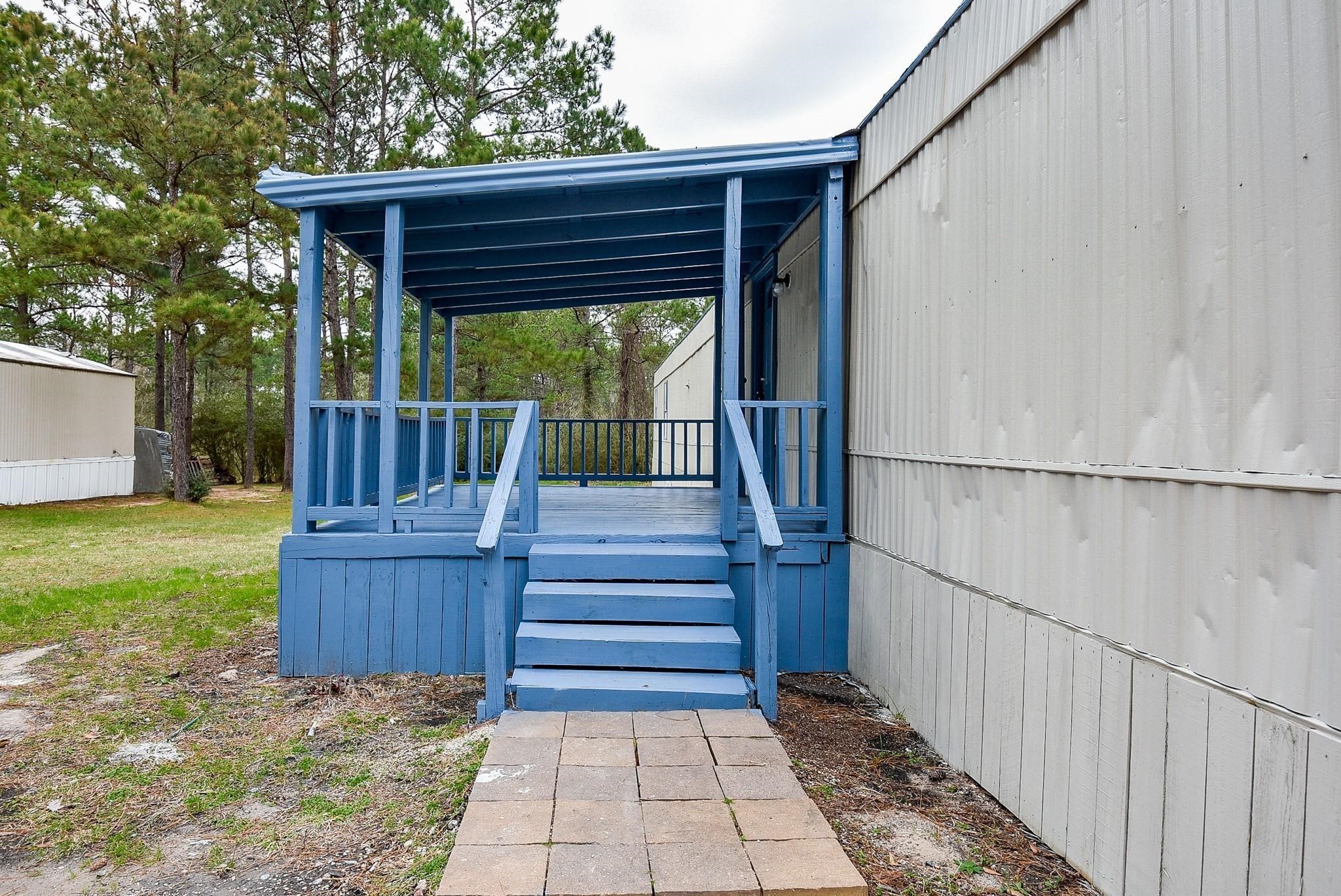 12842 Roy Harris Loop Conroe, TX 77306 - Photo 13 of 36 a view of deck with wooden floor and fence