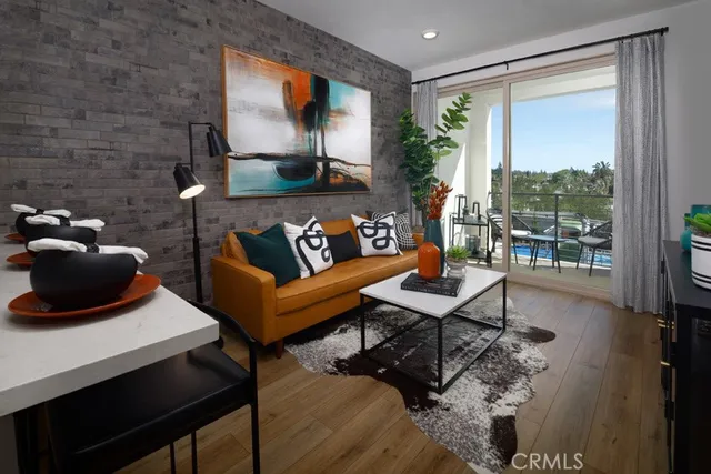 a living room with furniture and a floor to ceiling window