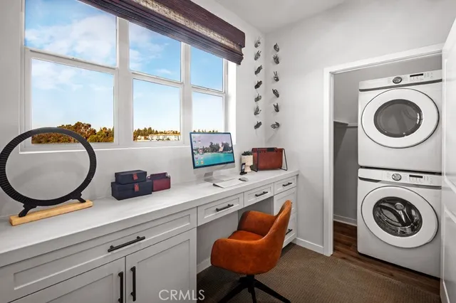 a kitchen with a stove a sink and a closet