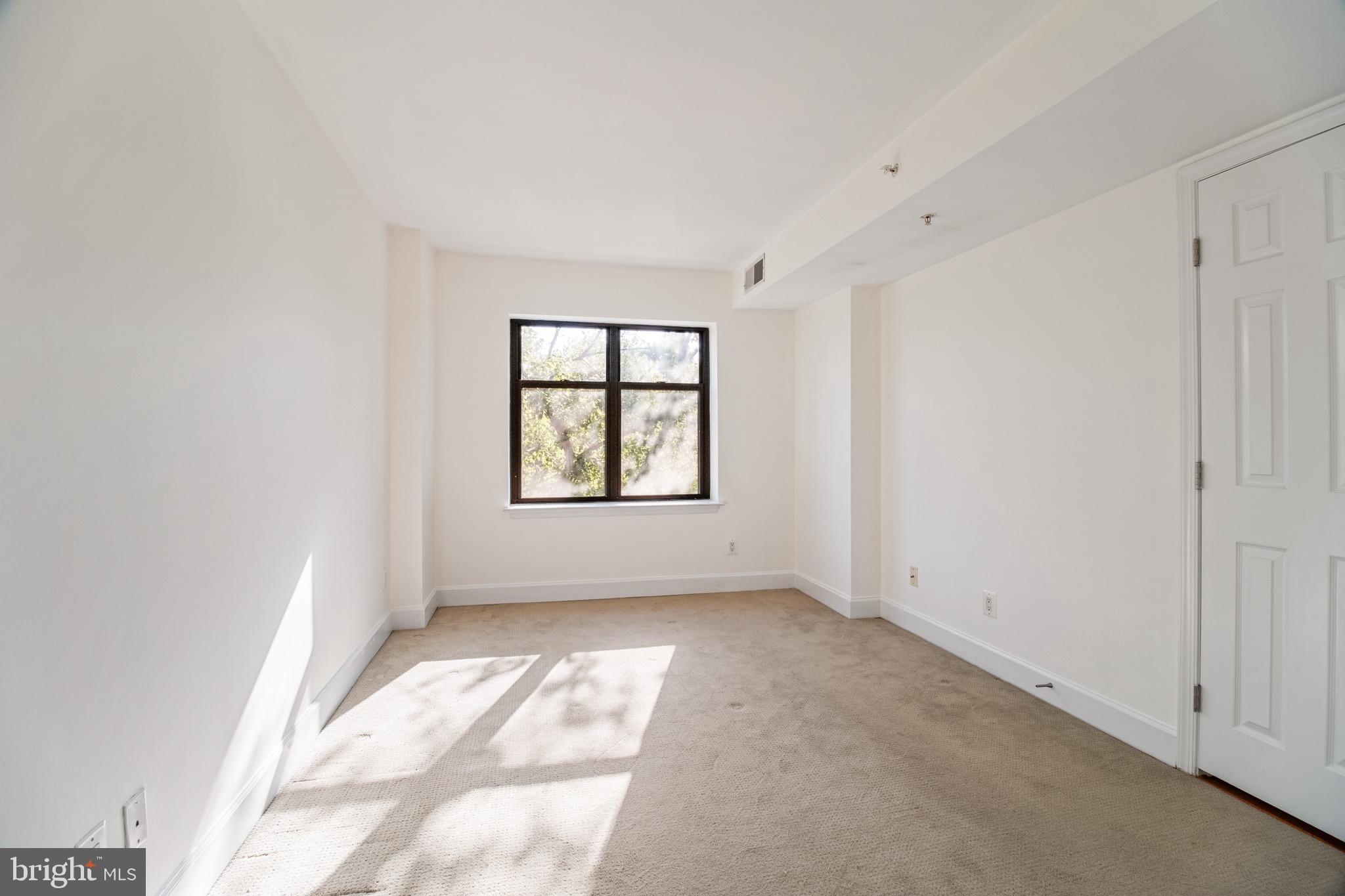 3401 38th Street Northwest, Unit 324 Washington, DC 20016 - Photo 11 of 23 an empty room with windows