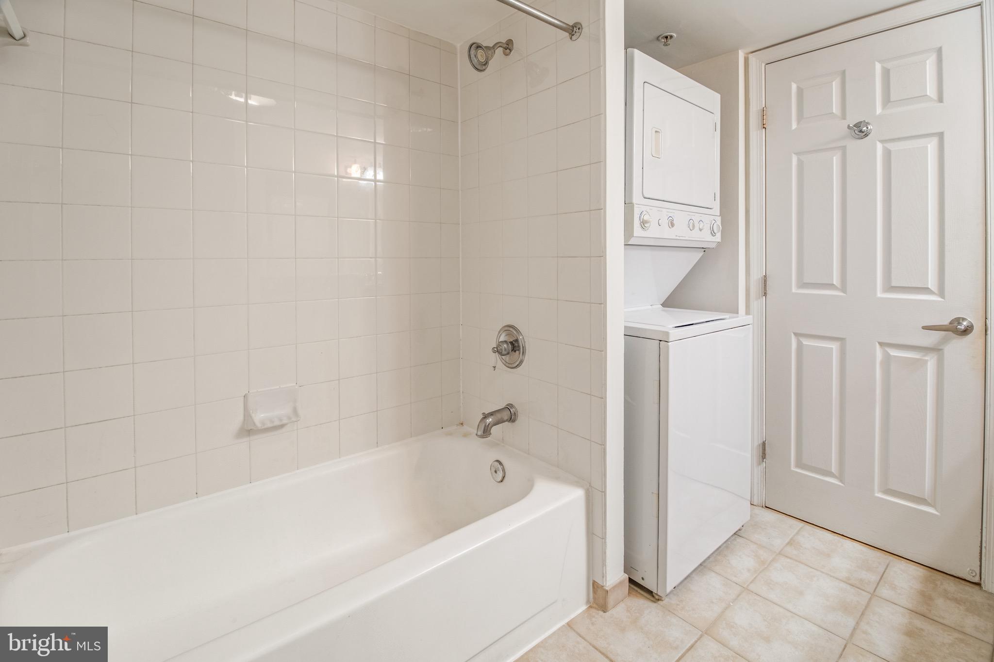 3401 38th Street Northwest, Unit 324 Washington, DC 20016 - Photo 15 of 23 a bathroom with a bathtub and shower