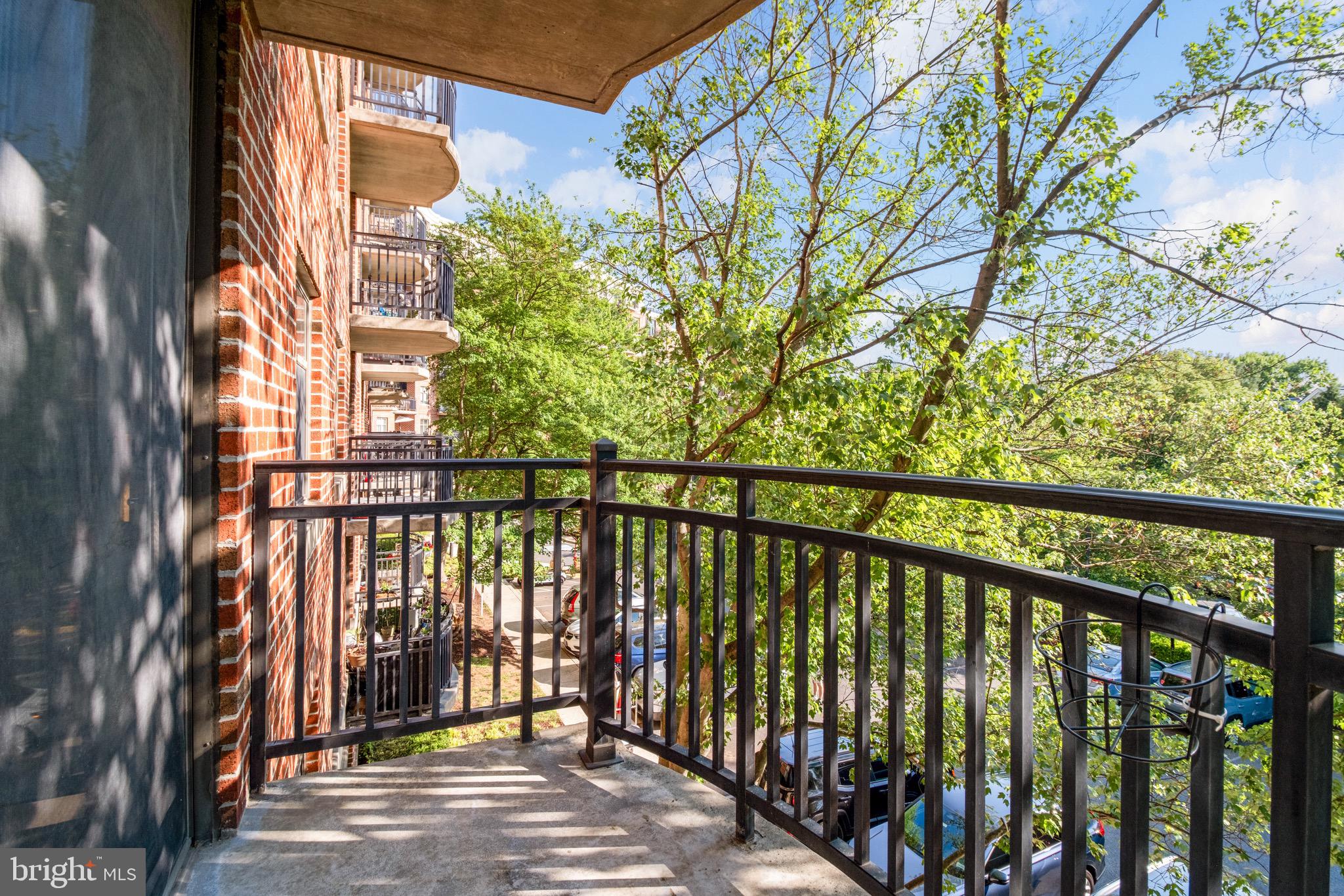 3401 38th Street Northwest, Unit 324 Washington, DC 20016 - Photo 17 of 23 a view of a balcony with wooden floor