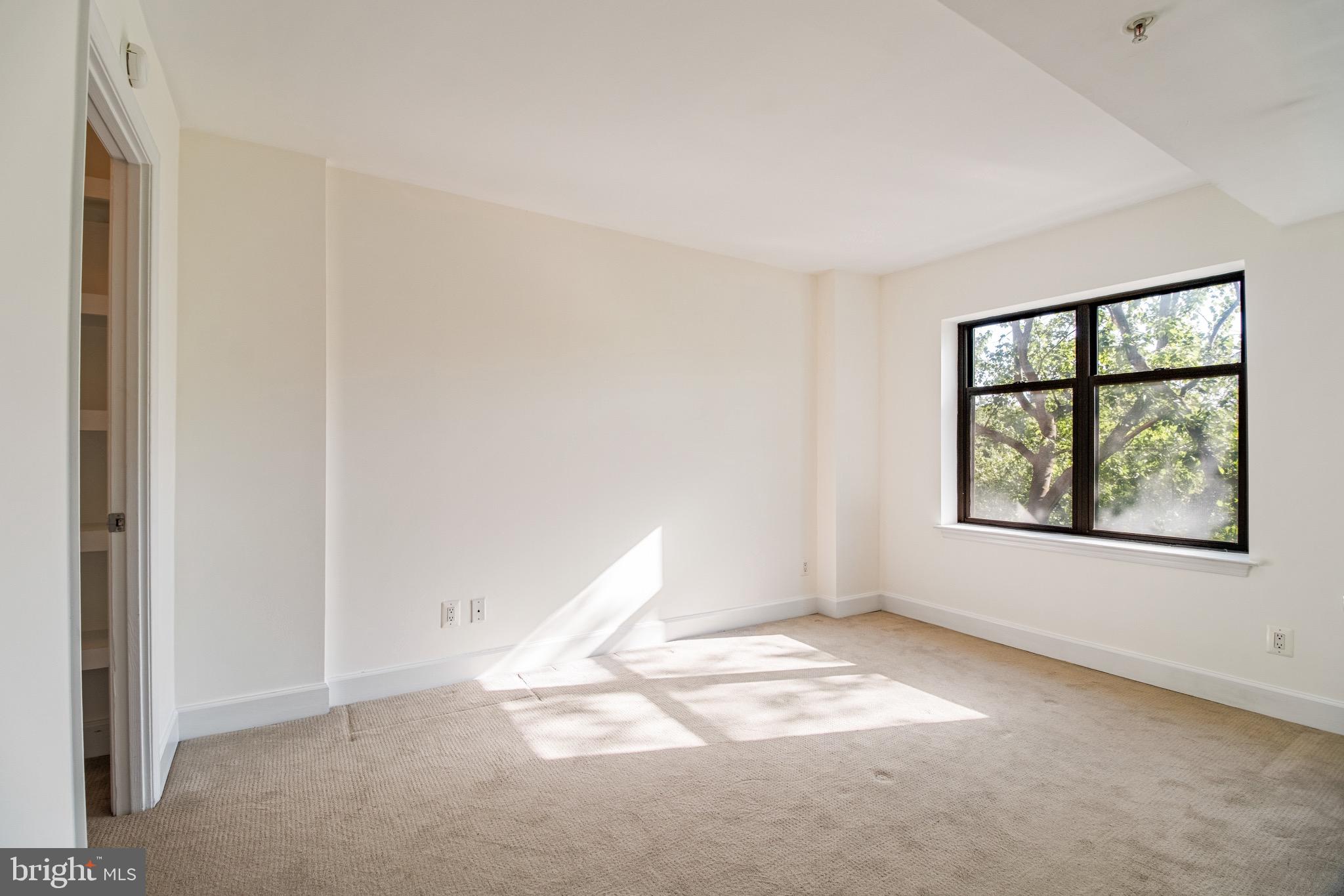 3401 38th Street Northwest, Unit 324 Washington, DC 20016 - Photo 10 of 23 an empty room with windows
