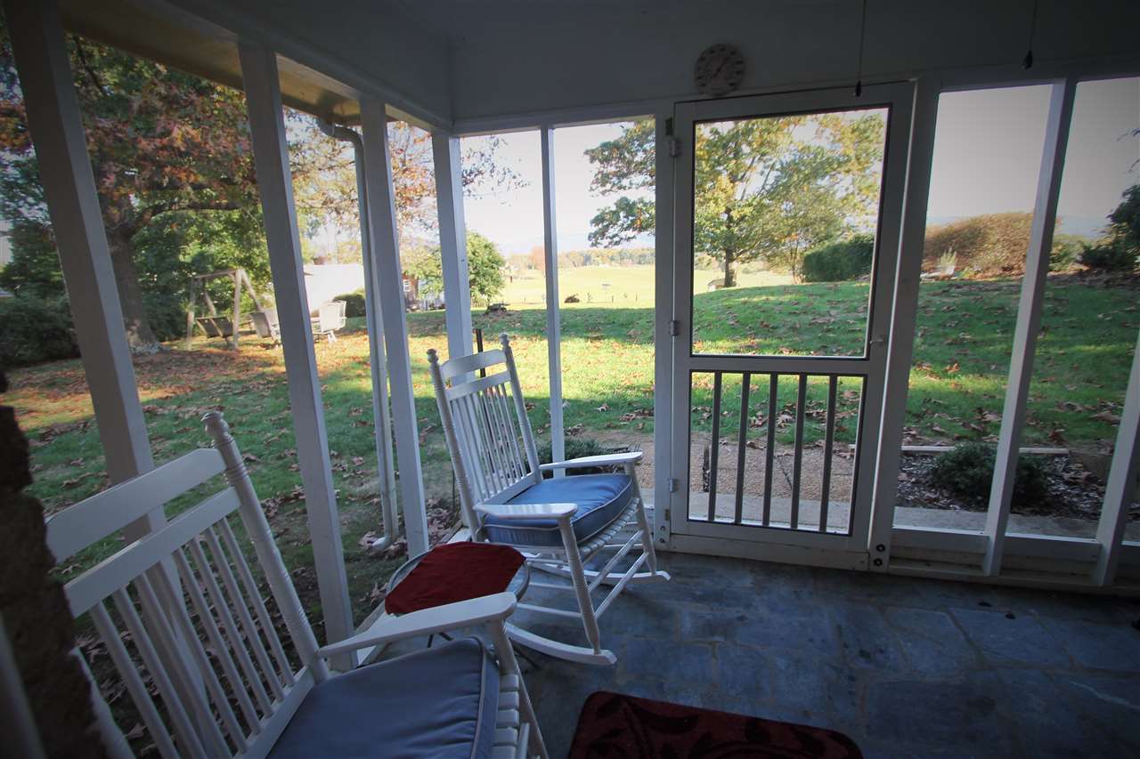 95 Cattle Scales Road Waynesboro, VA 22980 - Photo 13 of 50 a living room with a couch and a floor to ceiling window
