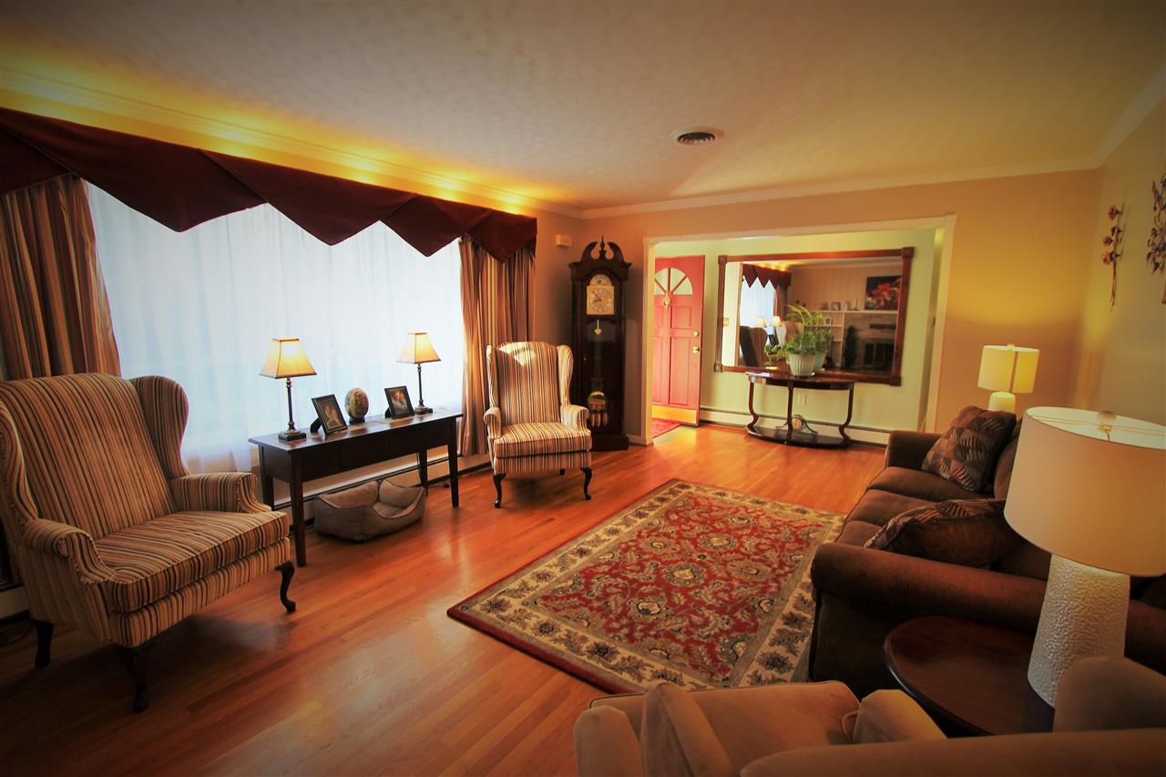 95 Cattle Scales Road Waynesboro, VA 22980 - Photo 23 of 50 a living room with furniture a rug and a floor to ceiling window