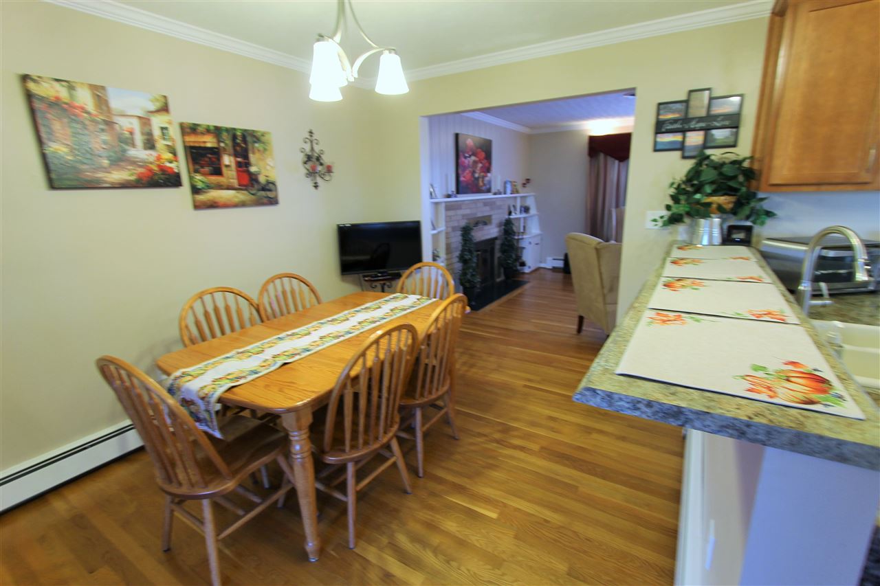 95 Cattle Scales Road Waynesboro, VA 22980 - Photo 27 of 50 a view of a dining room with furniture a chandelier and wooden floor