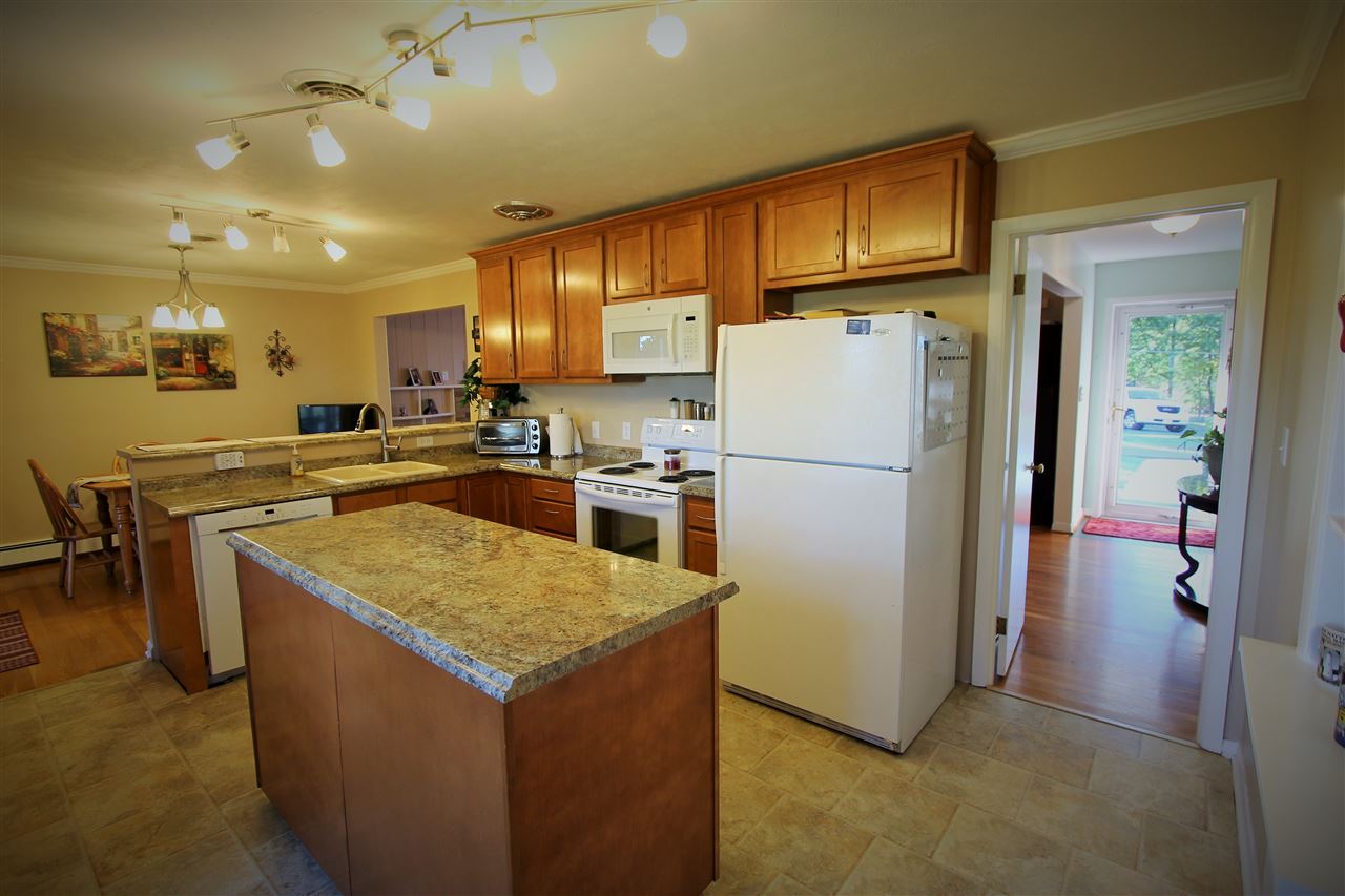 95 Cattle Scales Road Waynesboro, VA 22980 - Photo 29 of 50 a kitchen with stainless steel appliances granite countertop a refrigerator a stove a sink a microwave and island