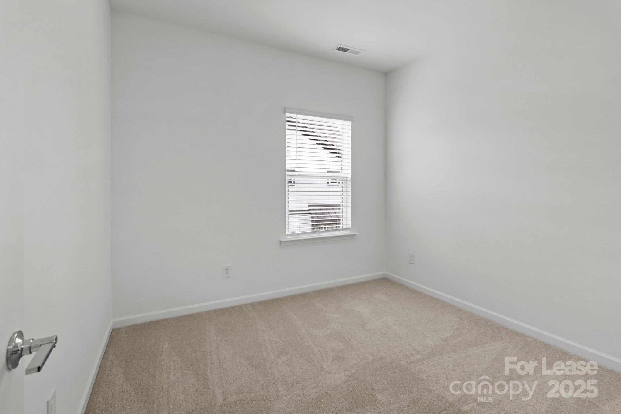 109 Goodson Place Davidson, NC 28036 - Photo 17 of 22 a view of an empty room with a window