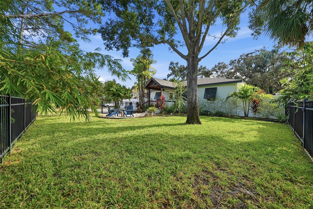 1830 Main Street Safety Harbor, FL 34695 - Photo 12 of 90 a view of house in front of a big yard with large trees