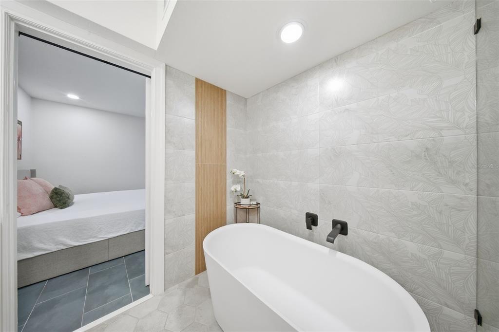 1830 Main Street Safety Harbor, FL 34695 - Photo 33 of 90 a bathroom with a sink and a bathtub