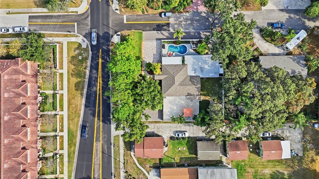 1830 Main Street Safety Harbor, FL 34695 - Photo 4 of 90 an aerial view of a house with a yard and garden
