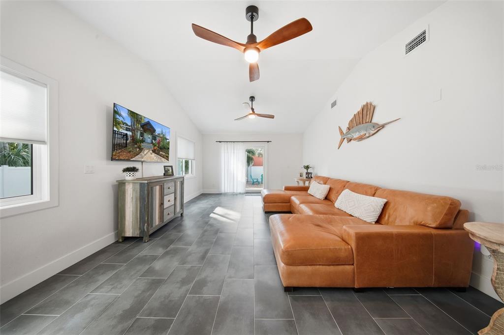 1830 Main Street Safety Harbor, FL 34695 - Photo 43 of 90 a living room with furniture and a flat screen tv