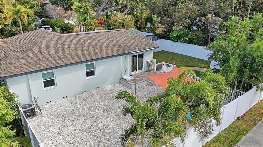 1830 Main Street Safety Harbor, FL 34695 - Photo 65 of 90 an aerial view of a house with yard and trees in the background