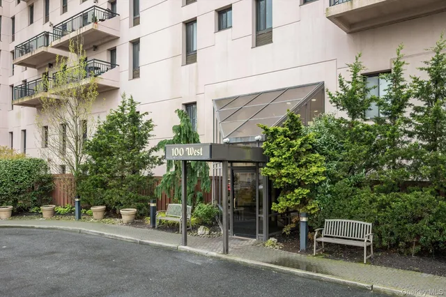 a view of a brick house with plants and outdoor space