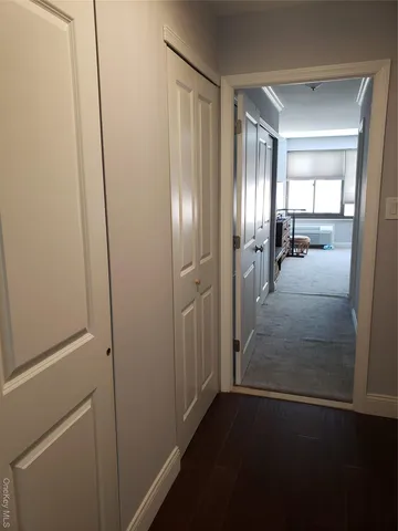 a view of hallway with livingroom
