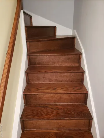 a view of a swimming pool with outdoor seating