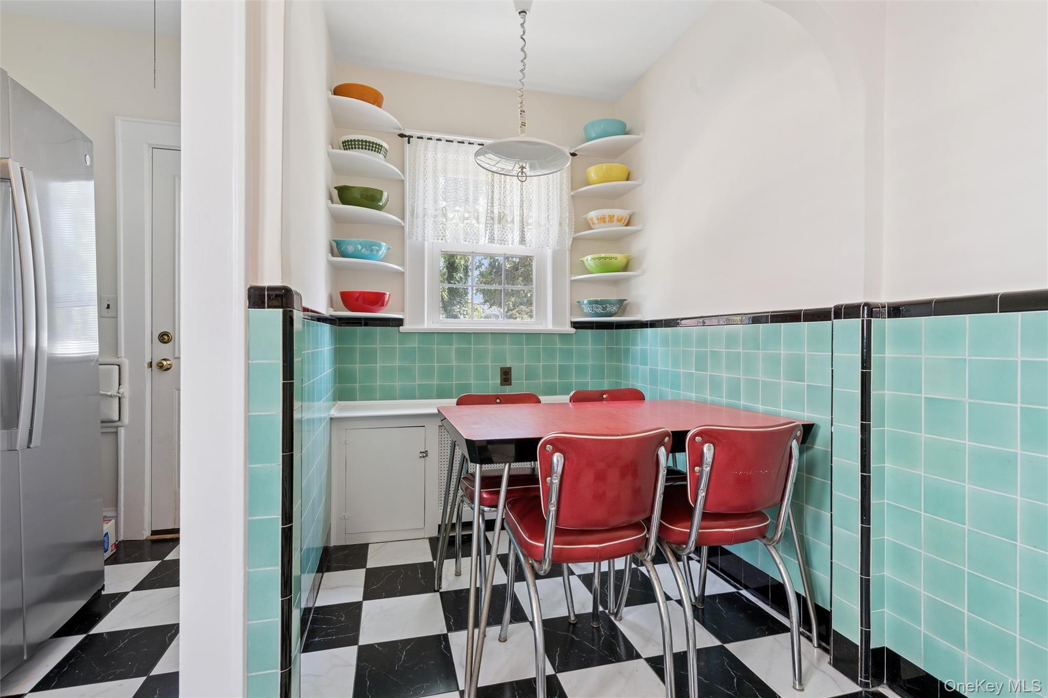 9 Troy Place Merrick, NY 11566 - Photo 11 of 23 a view of a dining room with furniture and chandelier