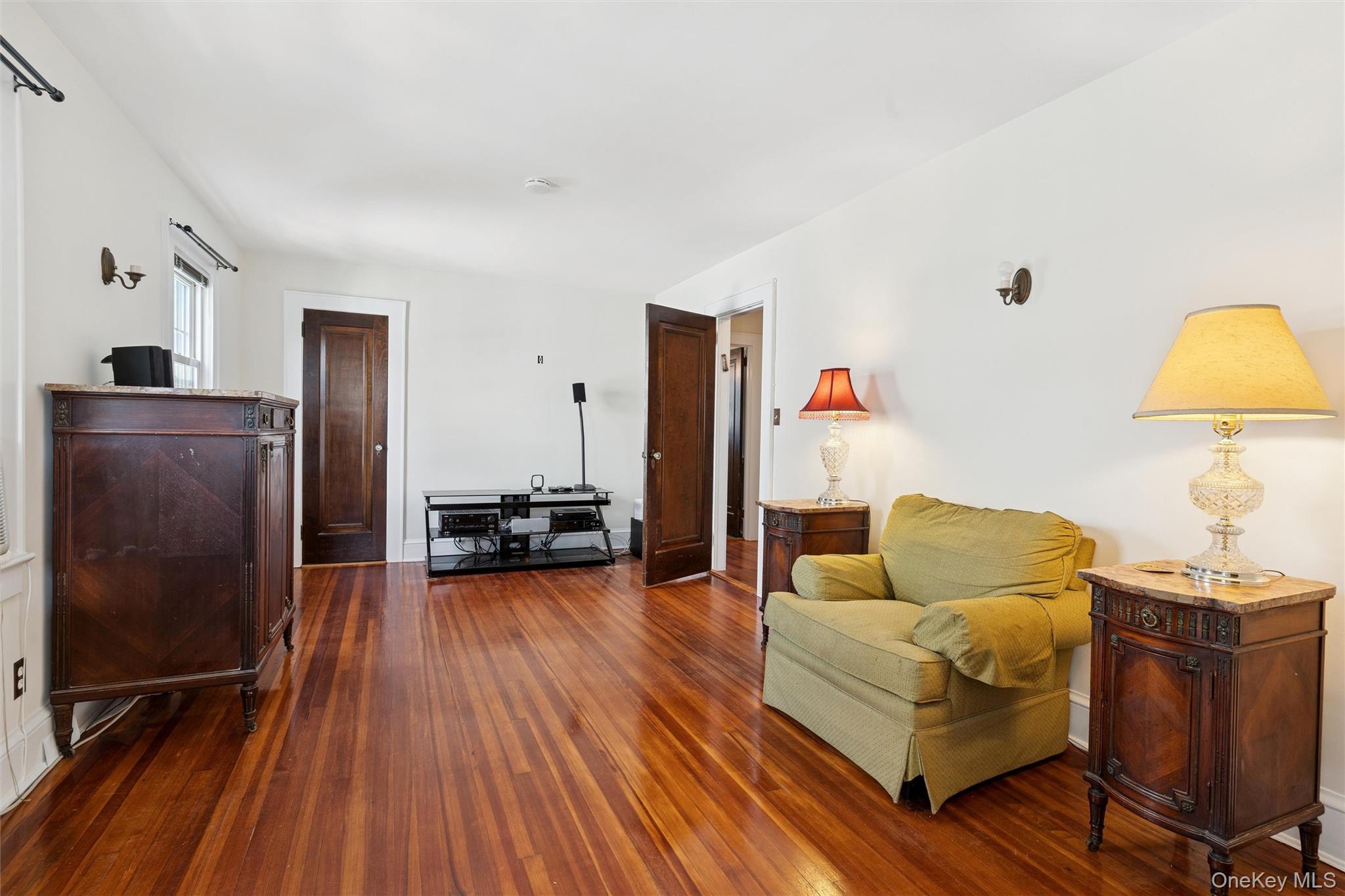 9 Troy Place Merrick, NY 11566 - Photo 15 of 23 a living room with furniture and a wooden floor