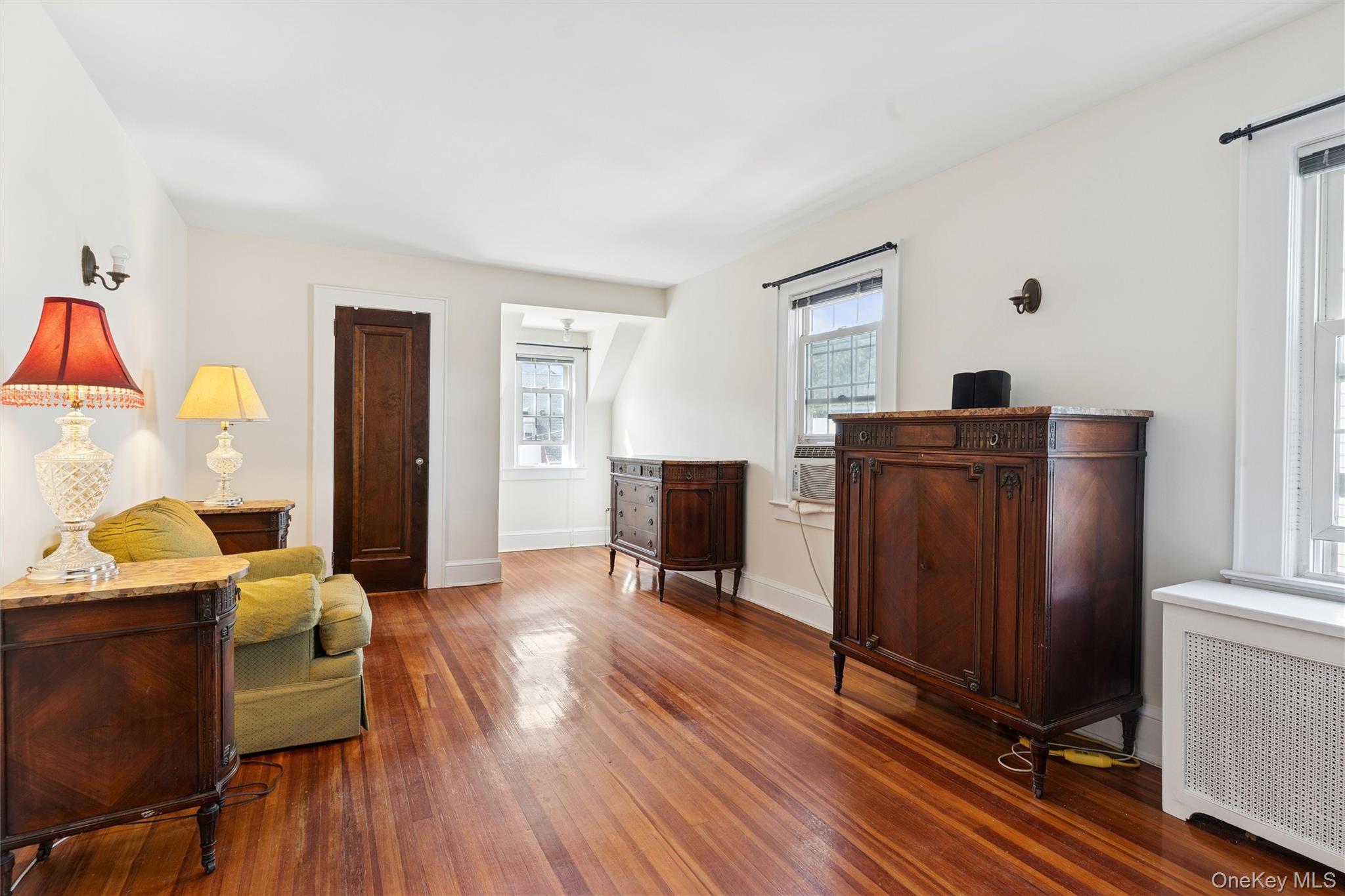 9 Troy Place Merrick, NY 11566 - Photo 16 of 23 a bedroom with furniture and wooden floor