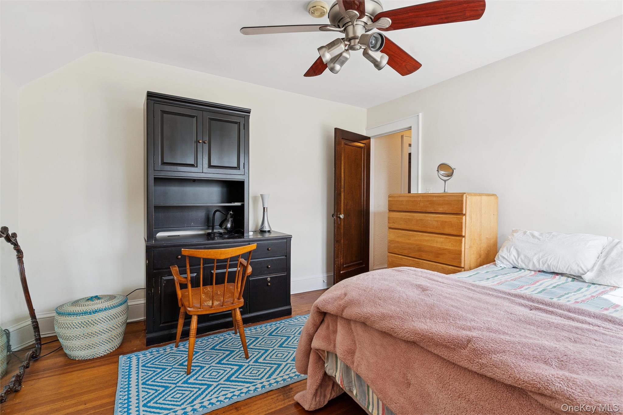 9 Troy Place Merrick, NY 11566 - Photo 17 of 23 a bedroom with a bed and wooden floor