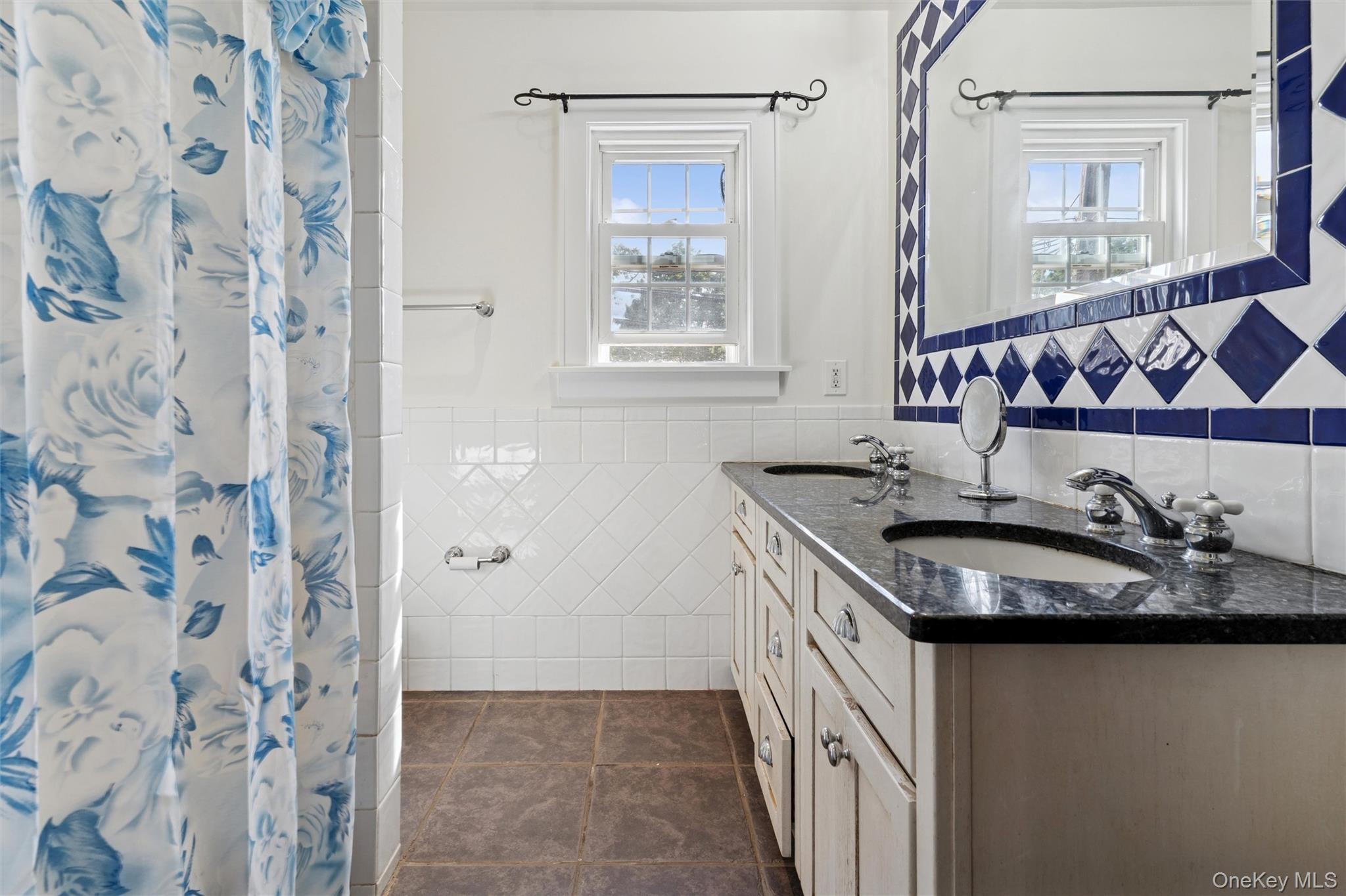 9 Troy Place Merrick, NY 11566 - Photo 18 of 23 a kitchen with stainless steel appliances granite countertop a sink and a granite counter tops