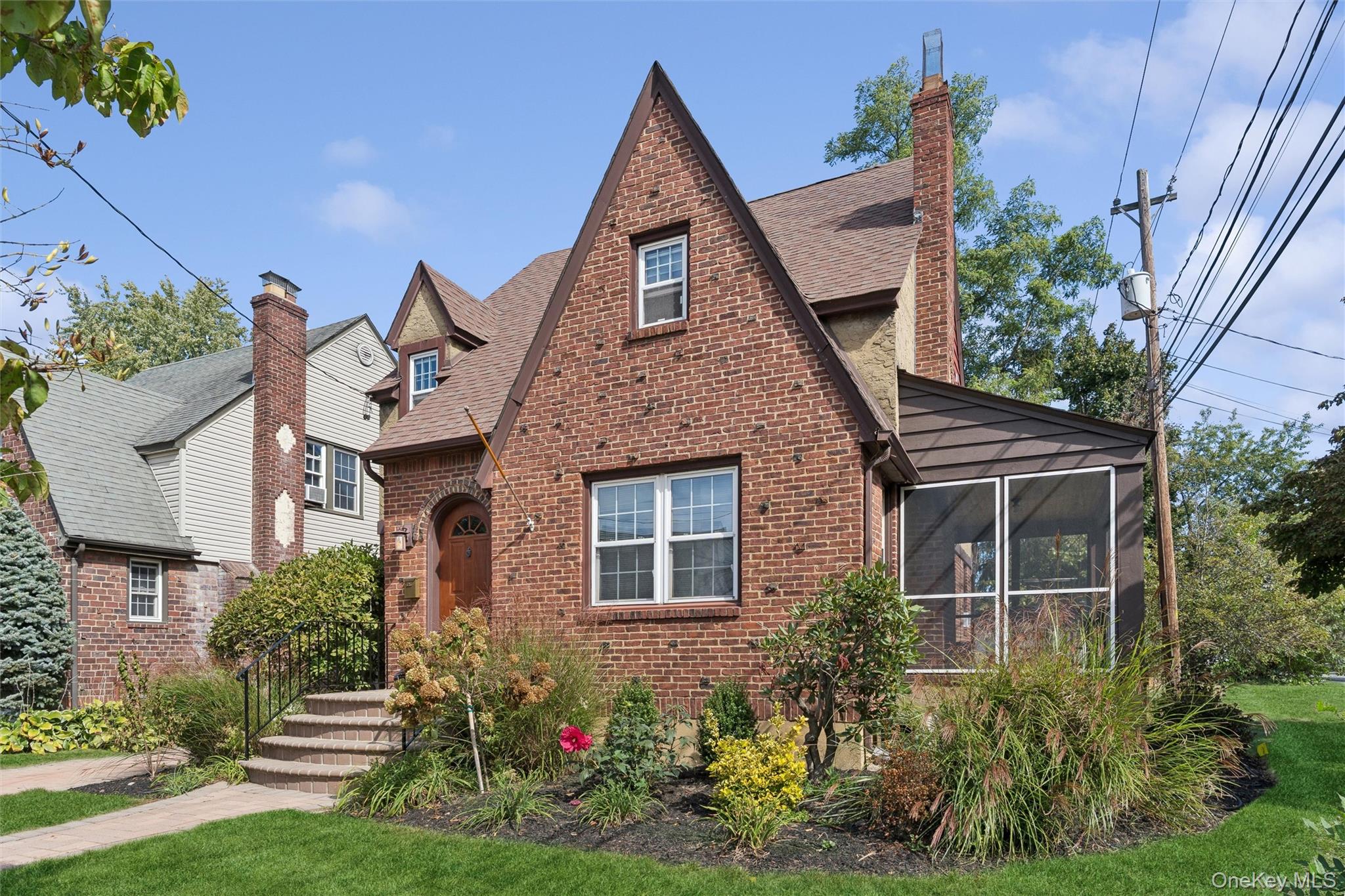 9 Troy Place Merrick, NY 11566 - Photo 2 of 23 front view of a house with a yard
