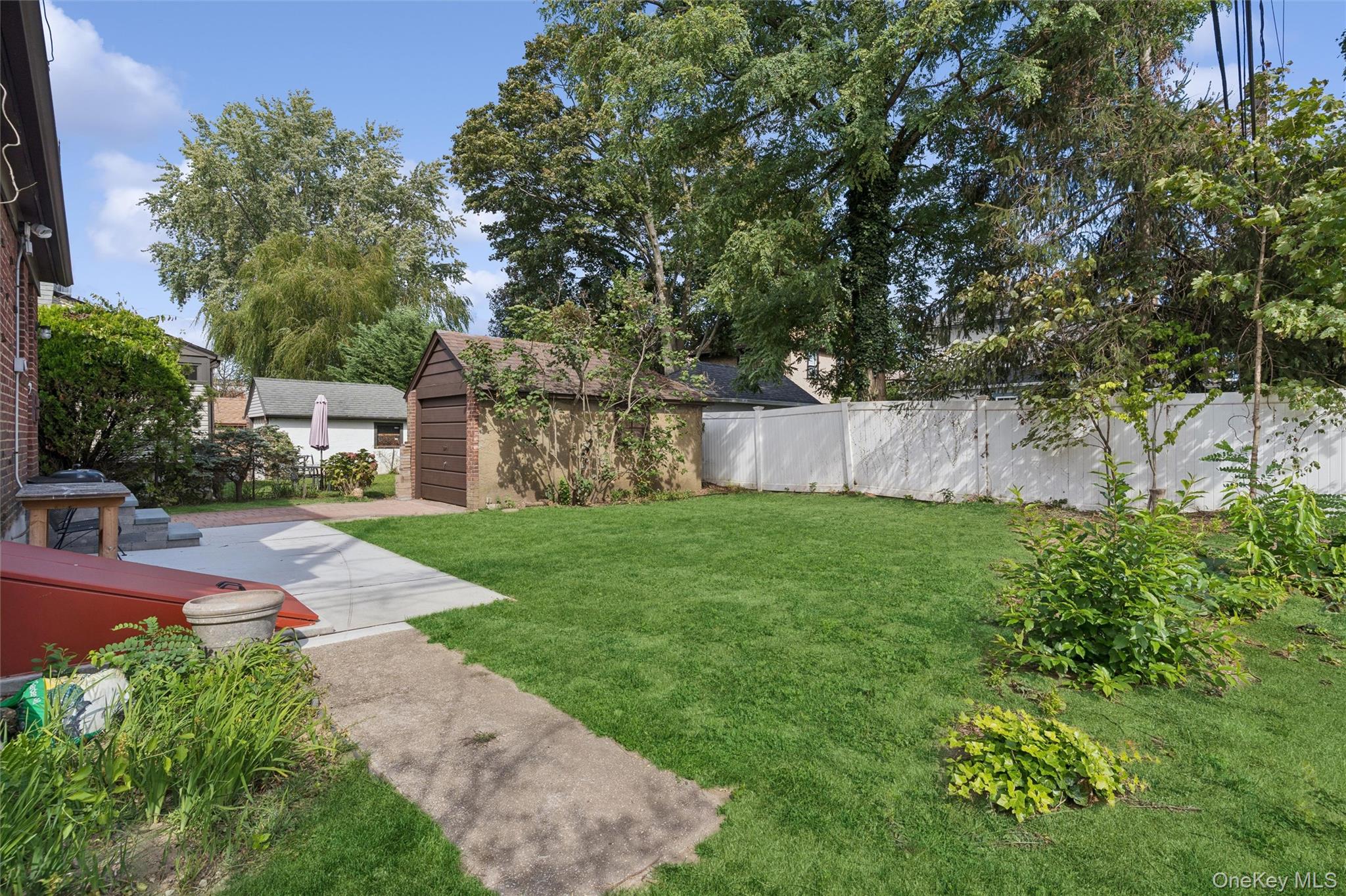9 Troy Place Merrick, NY 11566 - Photo 22 of 23 a view of a backyard with a garden