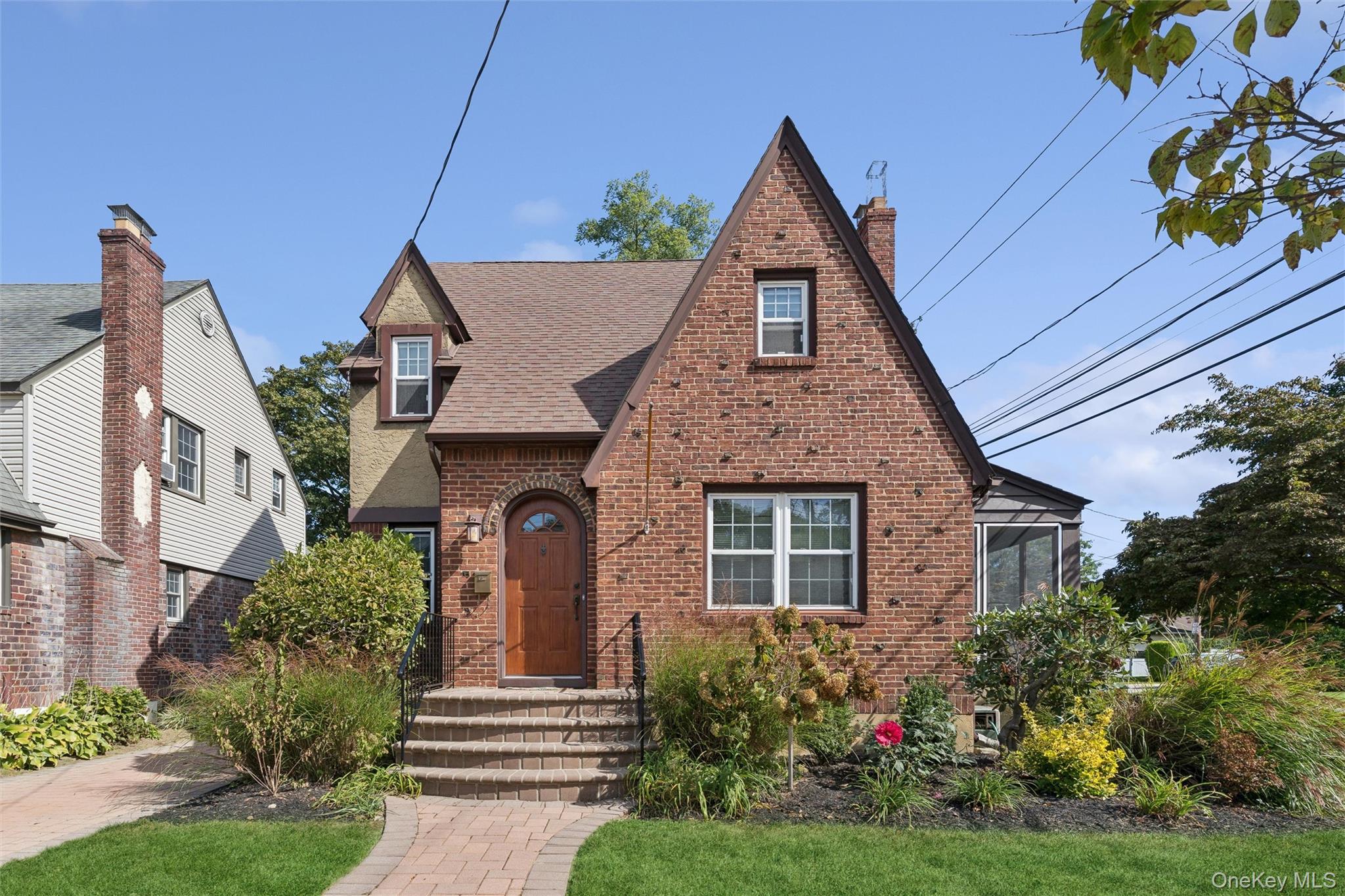 9 Troy Place Merrick, NY 11566 - Photo 23 of 23 a front view of a house with garden