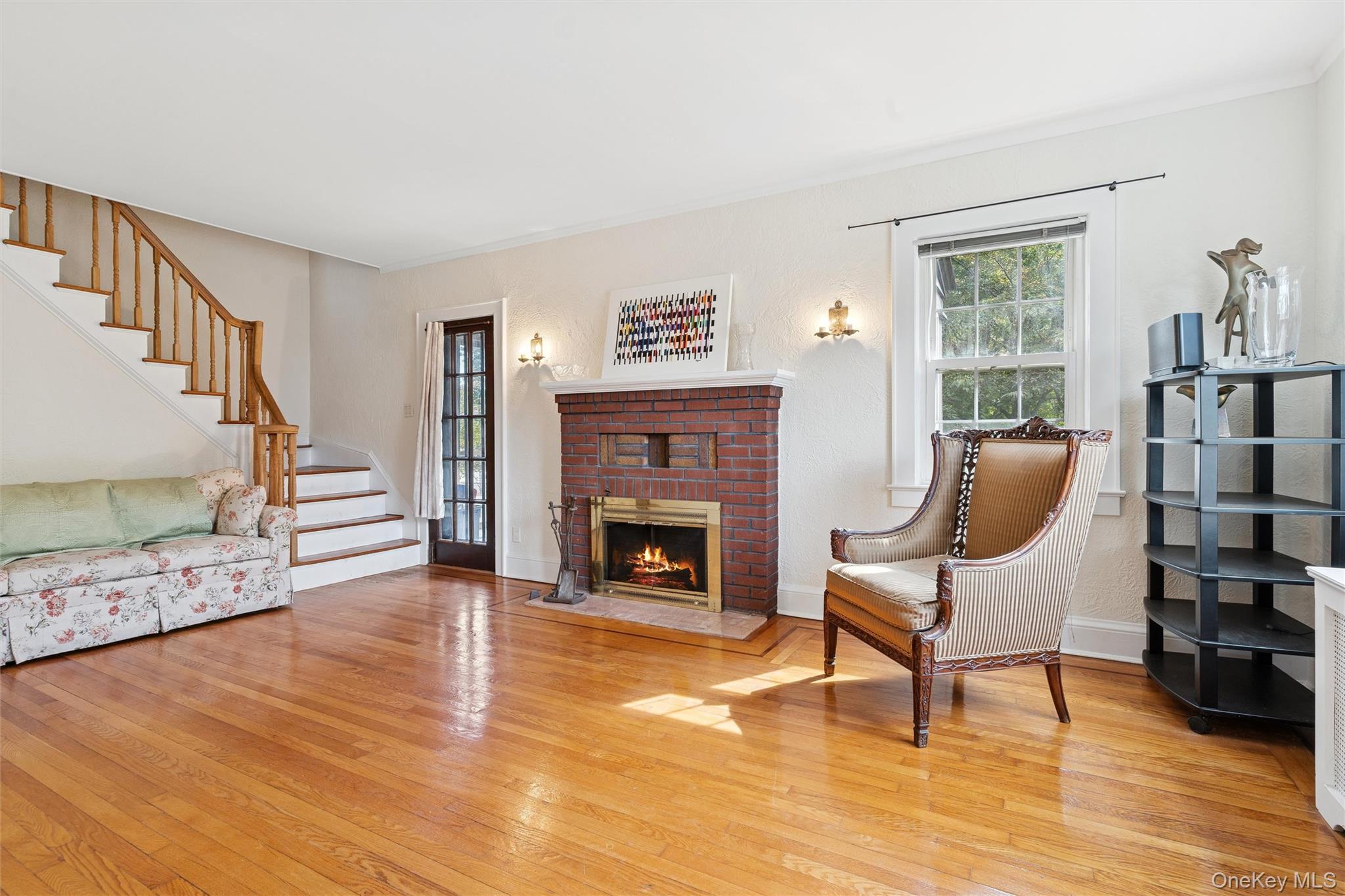 9 Troy Place Merrick, NY 11566 - Photo 3 of 23 a view of a livingroom with furniture a fireplace and windows