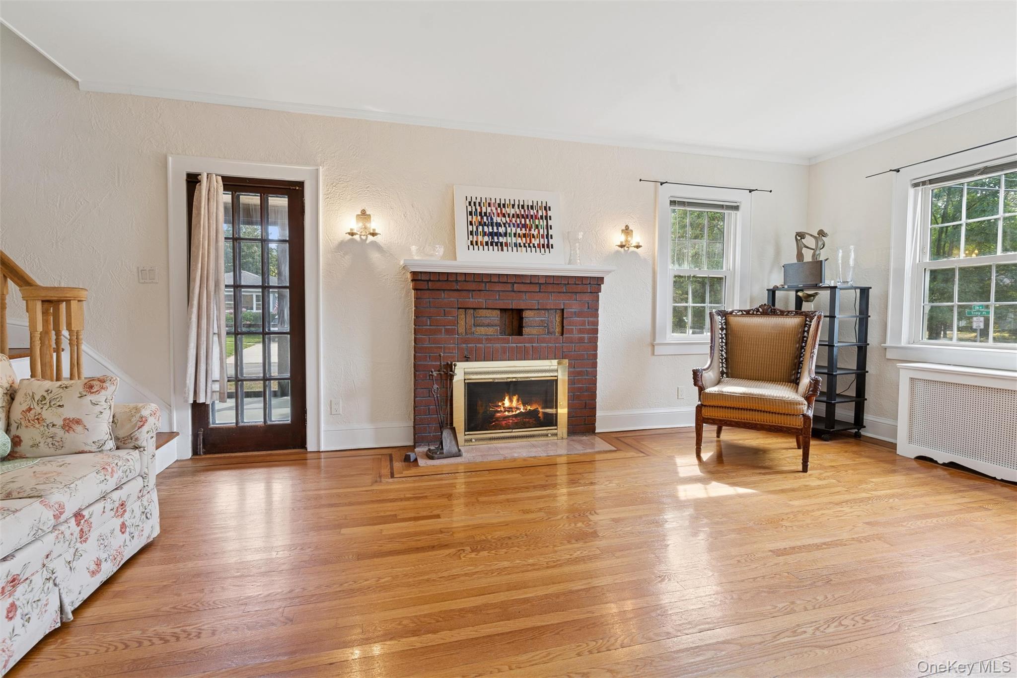 9 Troy Place Merrick, NY 11566 - Photo 4 of 23 a living room with furniture and a fireplace