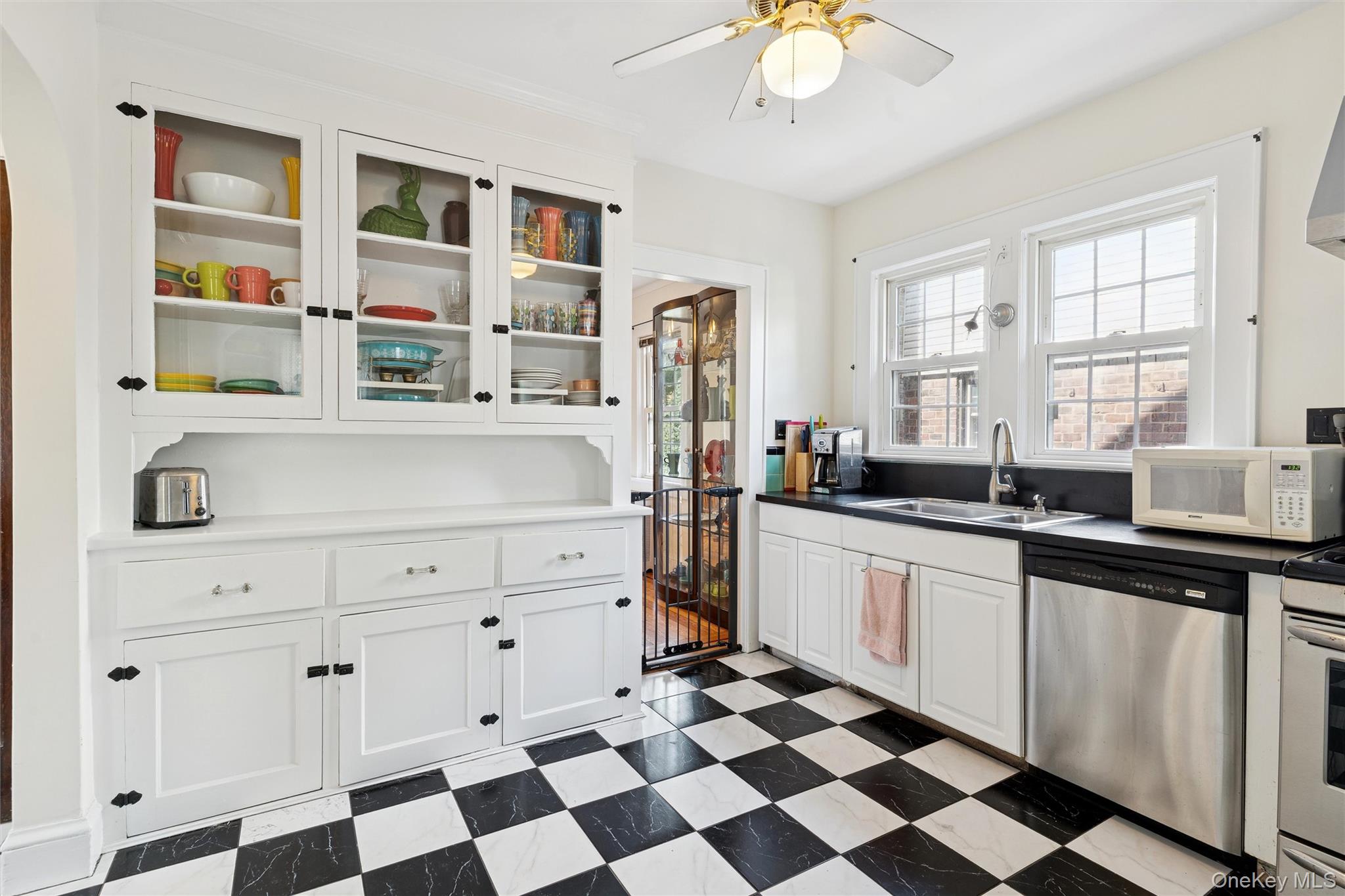 9 Troy Place Merrick, NY 11566 - Photo 9 of 23 a kitchen with stainless steel appliances a sink a stove a refrigerator and cabinets