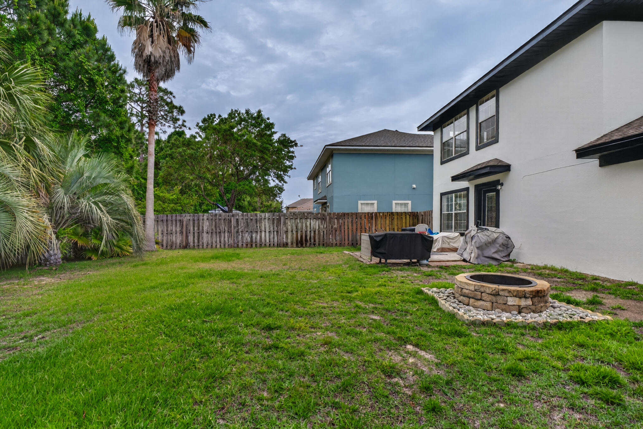 268 Loblolly Bay Drive Santa Rosa Beach, FL 32459 - Photo 55 of 73 a front view of a house with garden
