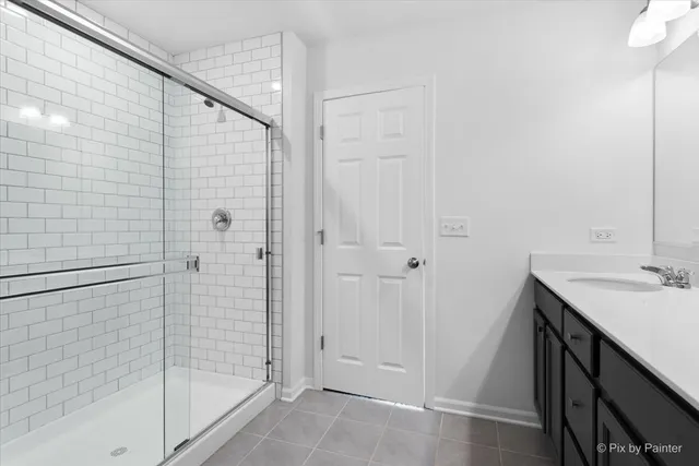 a bathroom with a sink and shower
