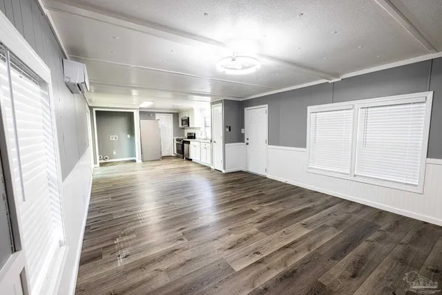 a view of a livingroom with wooden floor