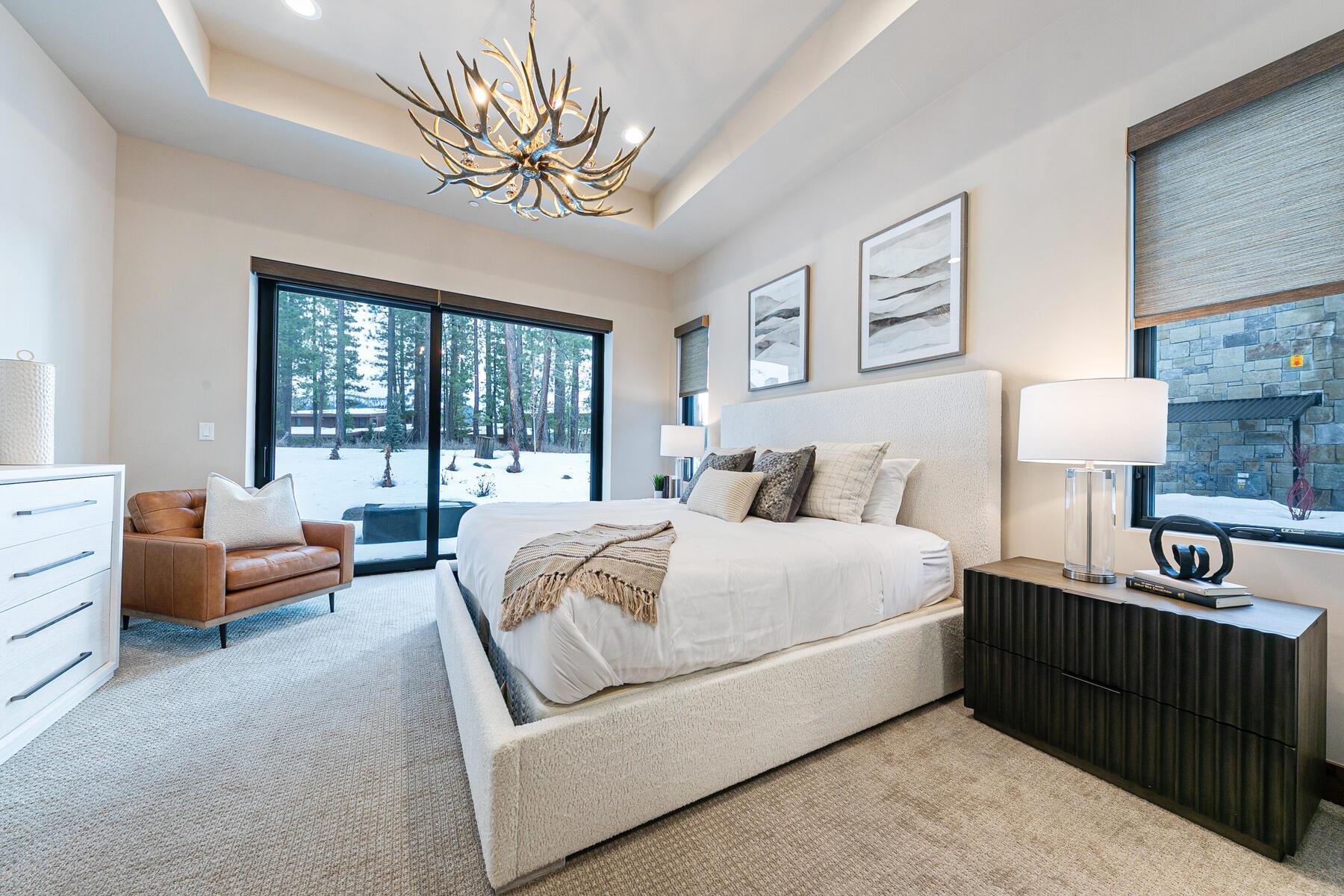 10232 Modane Place Truckee, CA 96161 - Photo 12 of 26 a bedroom with a bed and a couch