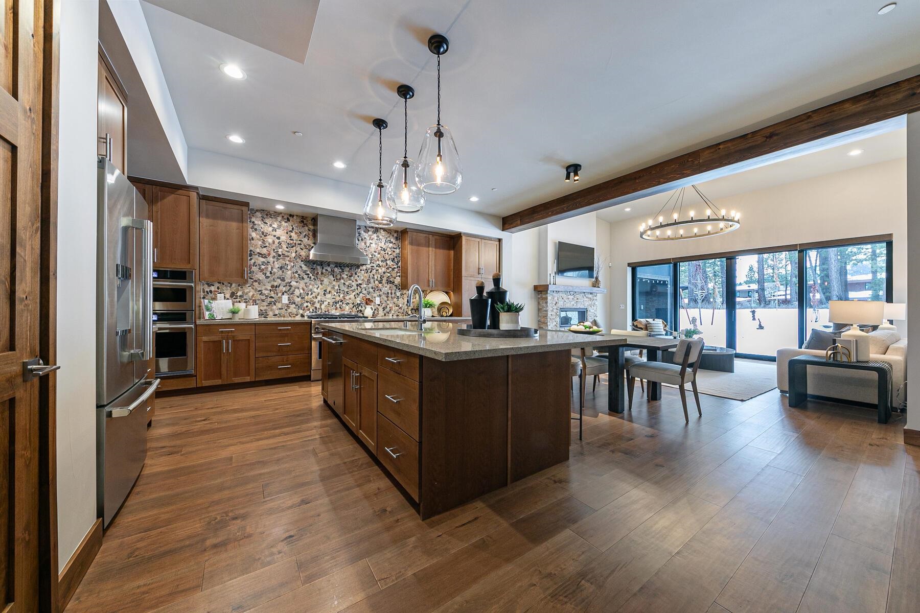 10232 Modane Place Truckee, CA 96161 - Photo 4 of 26 a kitchen with lots of counter top space and stainless steel appliances