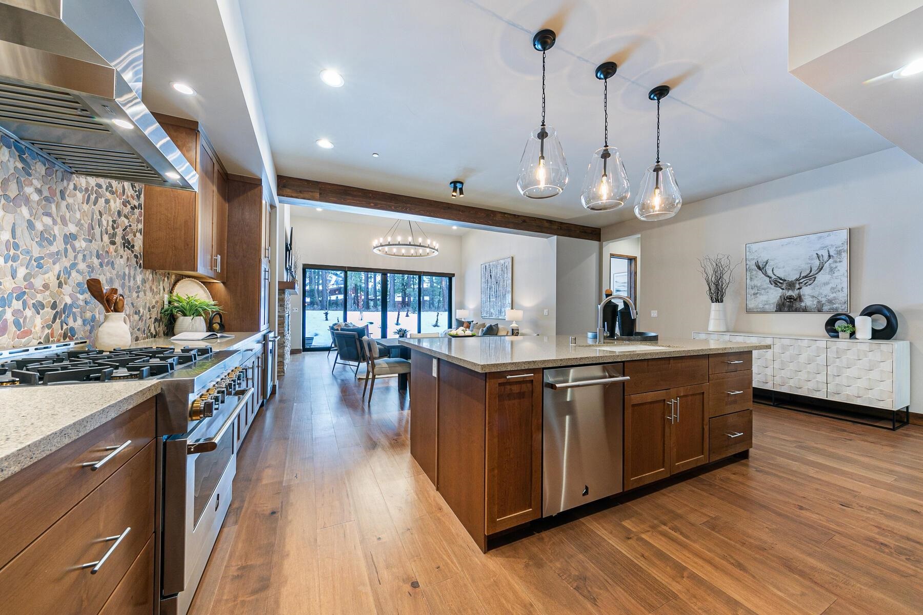 10232 Modane Place Truckee, CA 96161 - Photo 5 of 26 a large kitchen with stainless steel appliances granite countertop a lot of counter space and wooden floors