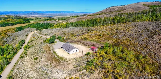 a view of a street with a yard
