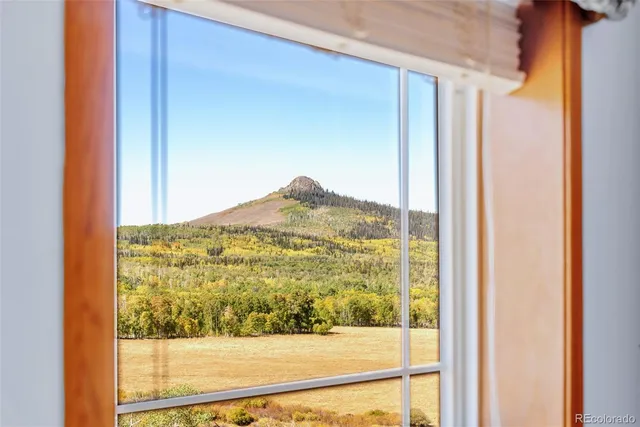 a view of a glass door and a window