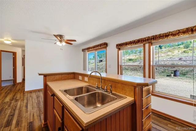 a kitchen that has a sink and a window