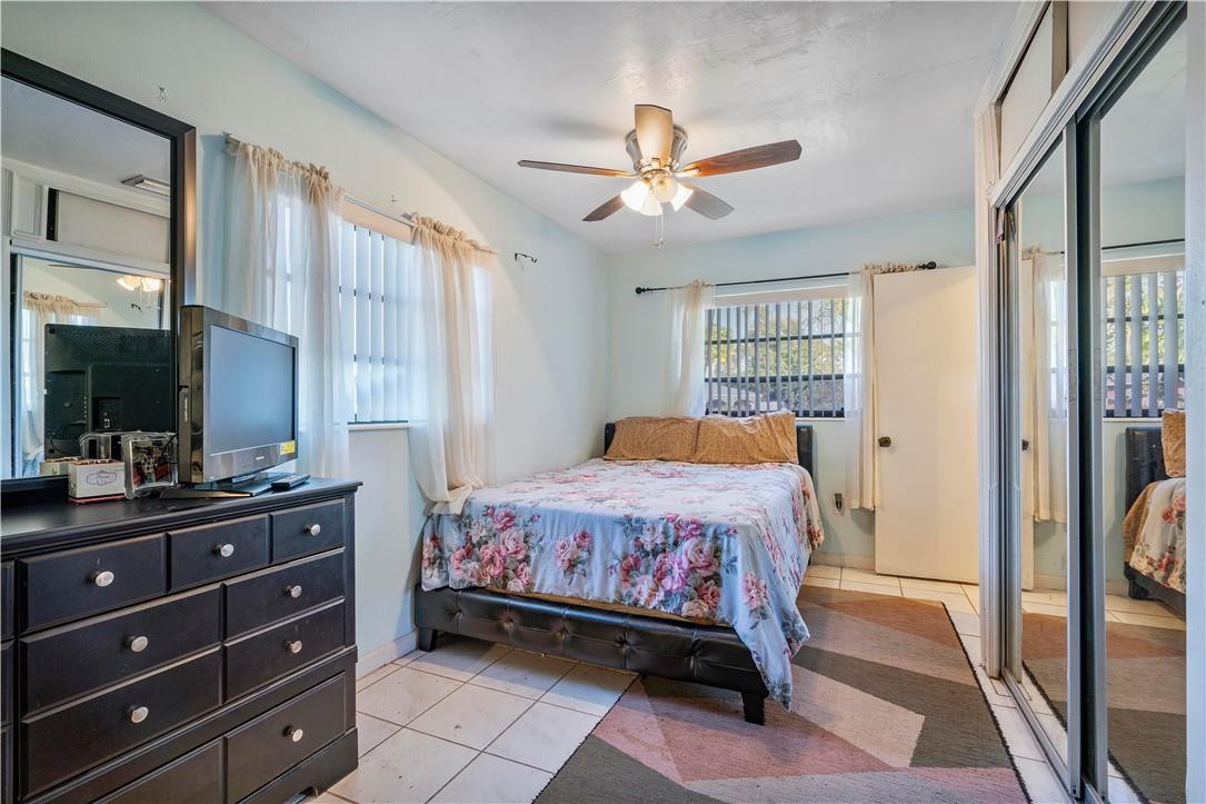 Undisclosed Address Miami, FL 33169 - Photo 15 of 24 a bedroom with a bed and a dresser