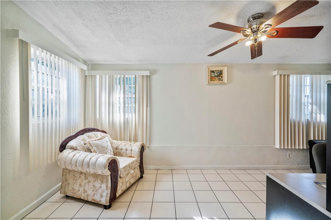 Undisclosed Address Miami, FL 33169 - Photo 21 of 24 a spacious bedroom with a bed and a couch