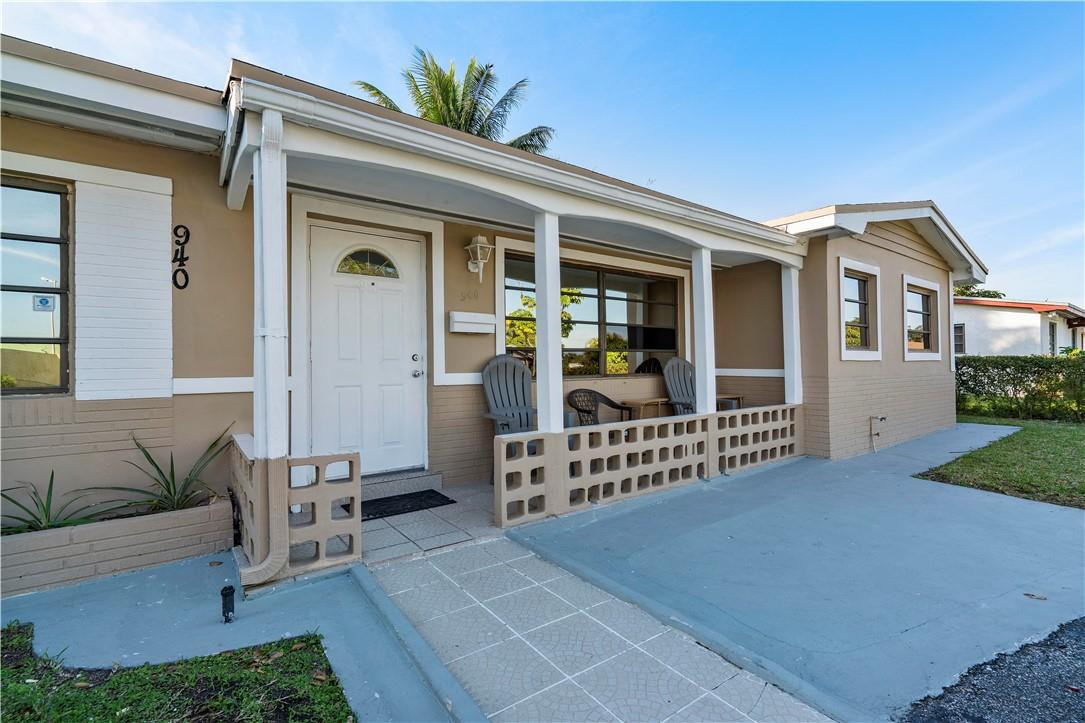 Undisclosed Address Miami, FL 33169 - Photo 5 of 24 a front view of a house with garden