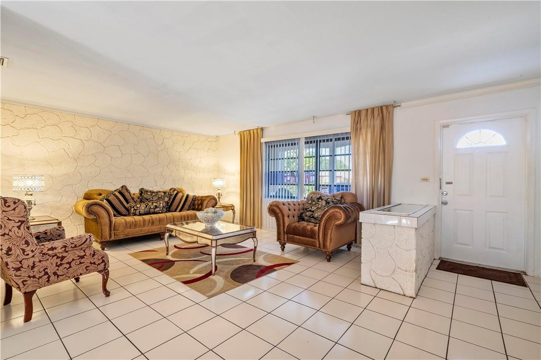 Undisclosed Address Miami, FL 33169 - Photo 7 of 24 a living room with furniture and a floor to ceiling window