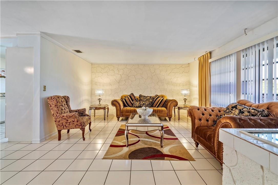 Undisclosed Address Miami, FL 33169 - Photo 8 of 24 a living room with furniture and a large window