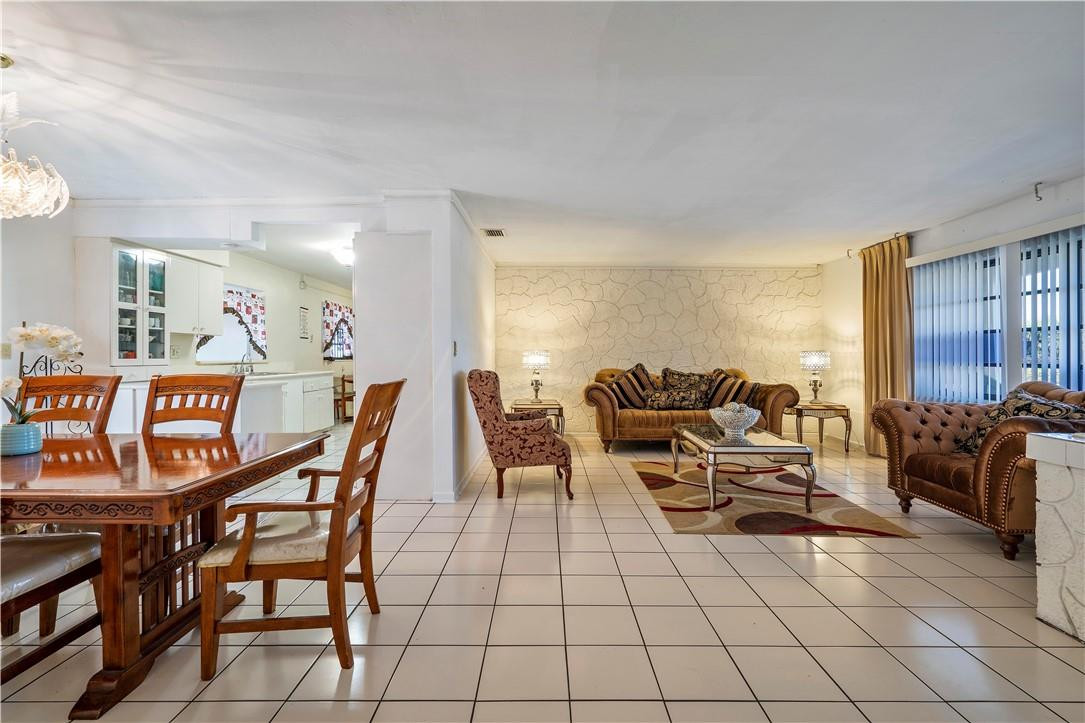 Undisclosed Address Miami, FL 33169 - Photo 9 of 24 a living room with furniture a air conditioner vent and a window